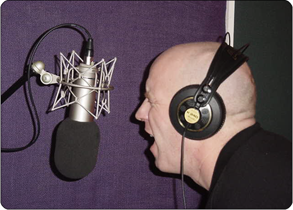 image of a man singing into a microphone